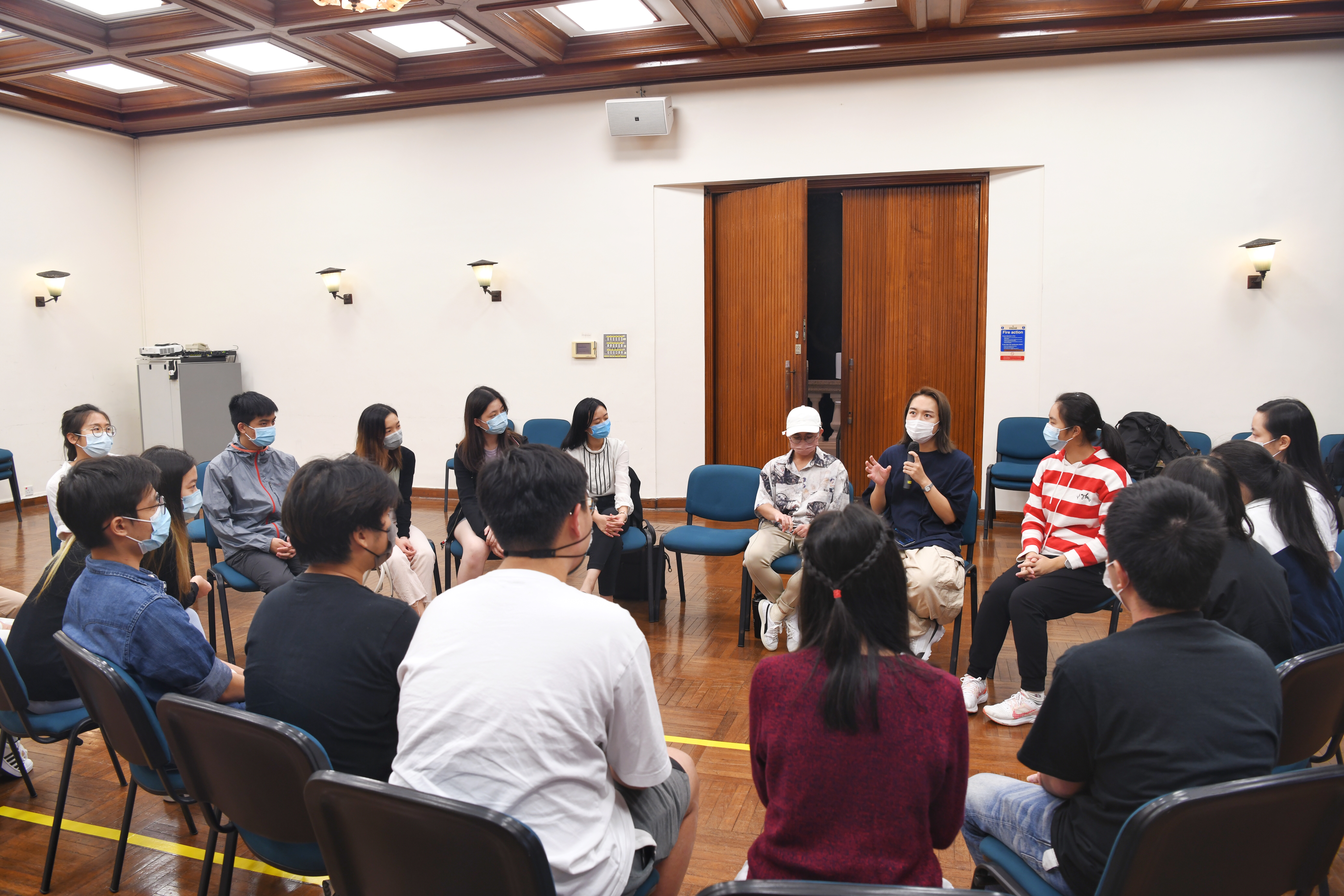 Event Photo: A group of EOSAs listening to the sharing of guest speakers